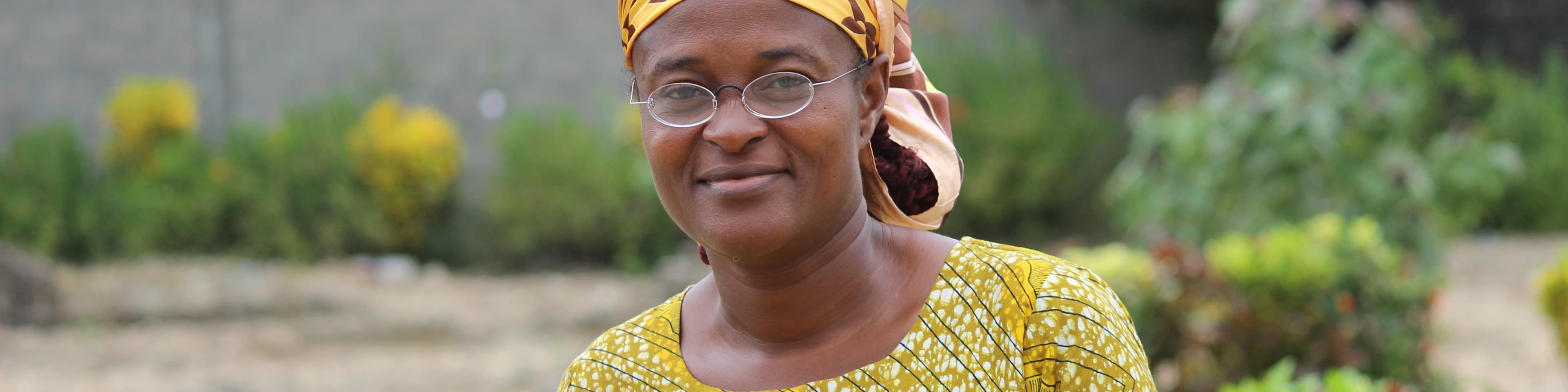 Traditionally dressed woman from Liberia with OneDollarGlasses