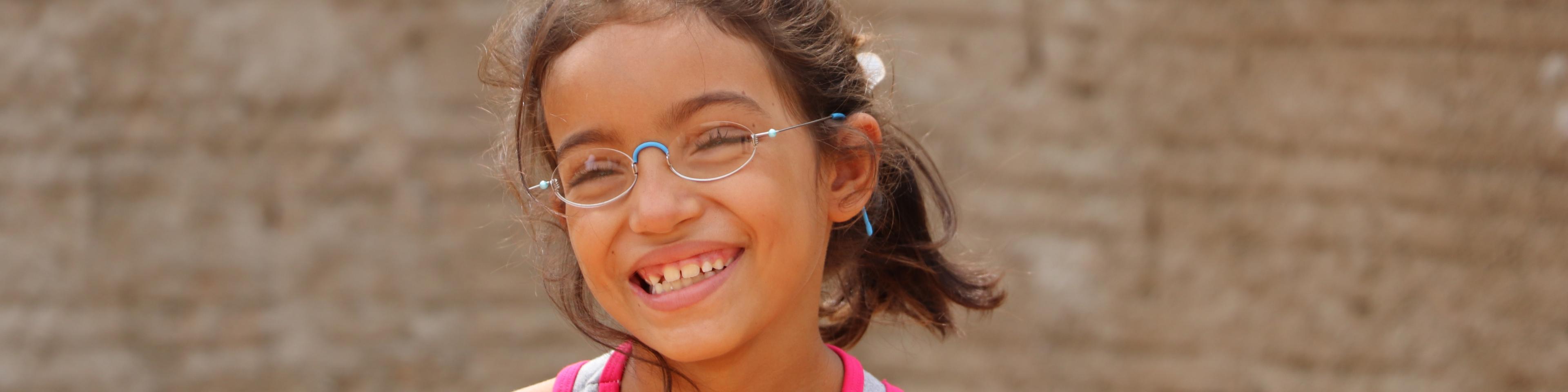 Smiling girl from Brazil with OneDollarGlasses