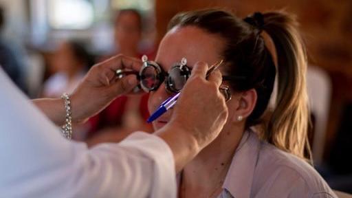 Woman gets eye test with measuring glasses