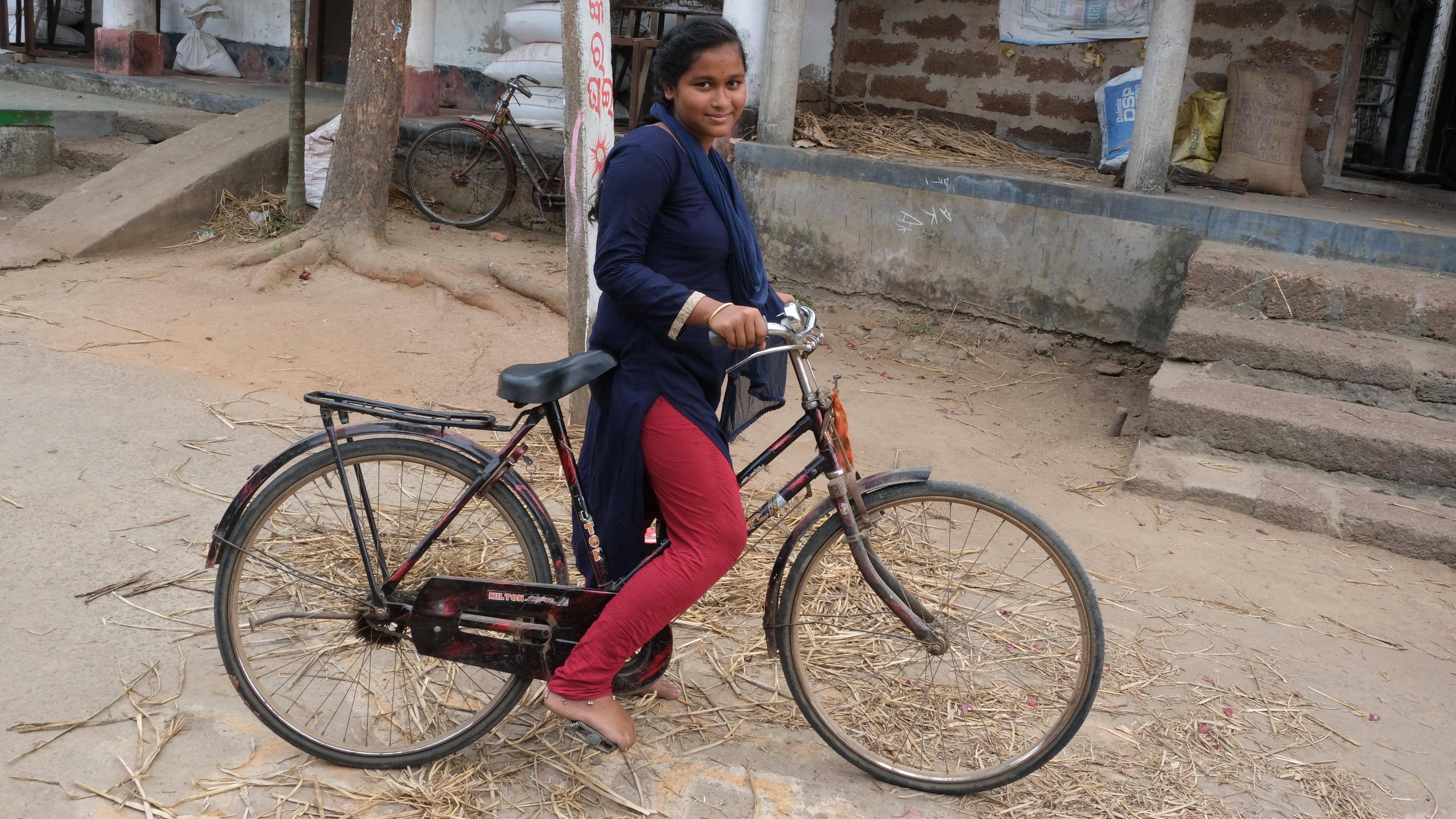 Indian girl with bicycle