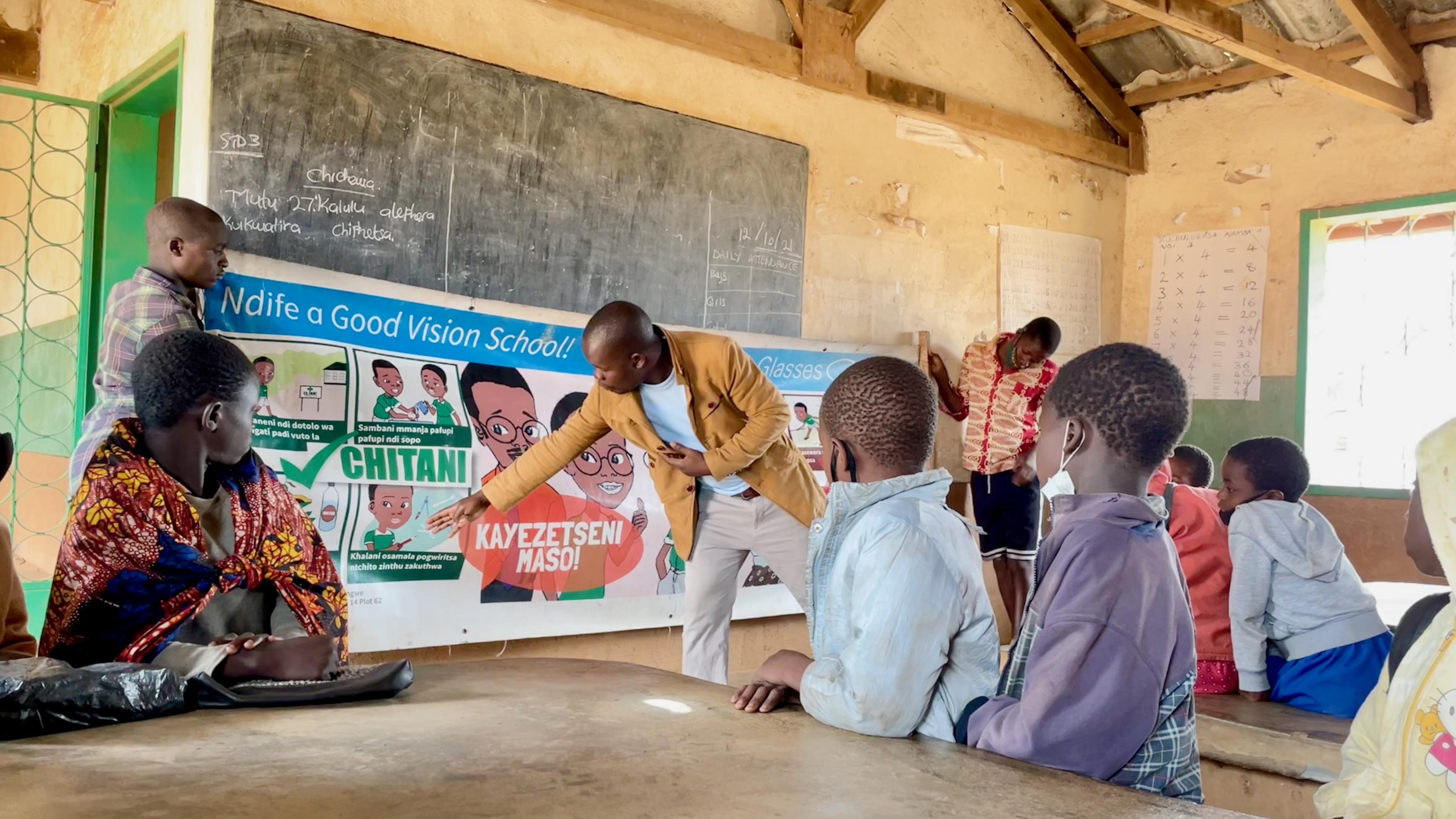 Teacher educates pupils about eye health in the classroom