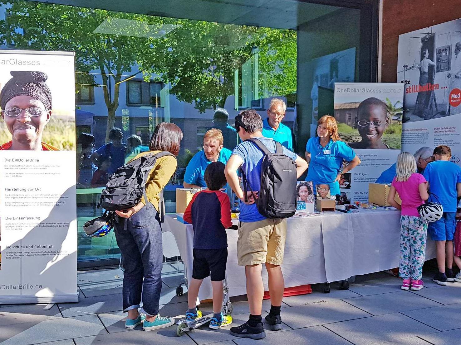 People at a GoodVision information stand
